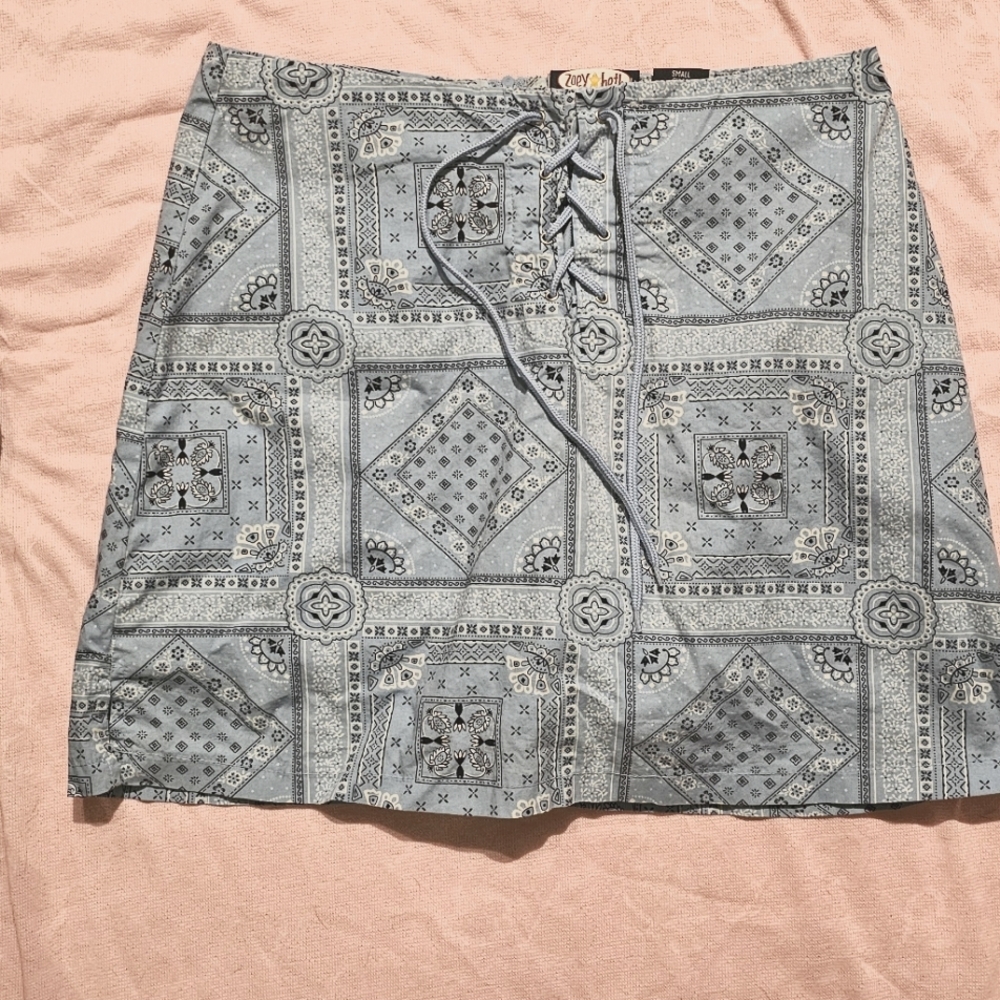 Light blue/ white, the design is a bandana mini skirt with built-in shorts large